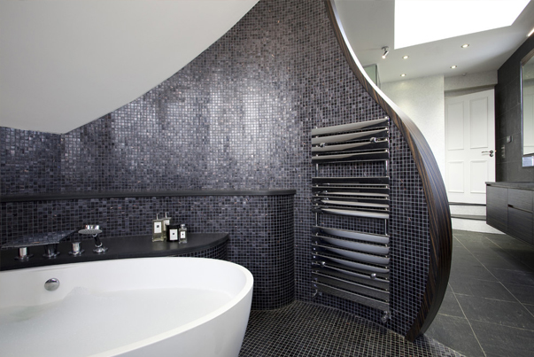 Whether it be curved walls or curved fixtures, curves are bound to make a splash in your bathroom in 2015.
